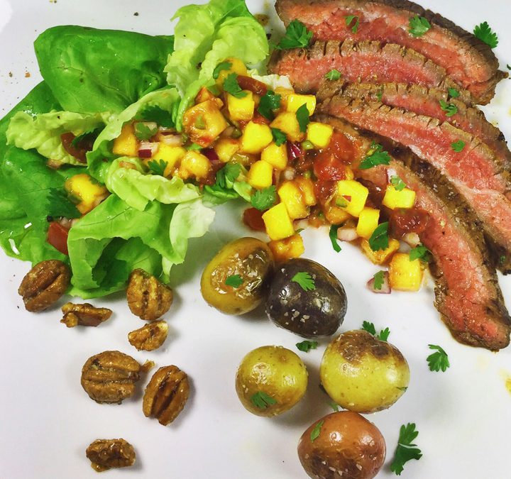 Grilled Flank Steak & Baby Potatoes with Mango Peach Salsa, Cherrywood Smoked Bibb Lettuce, and Candied Bourbon Pecans